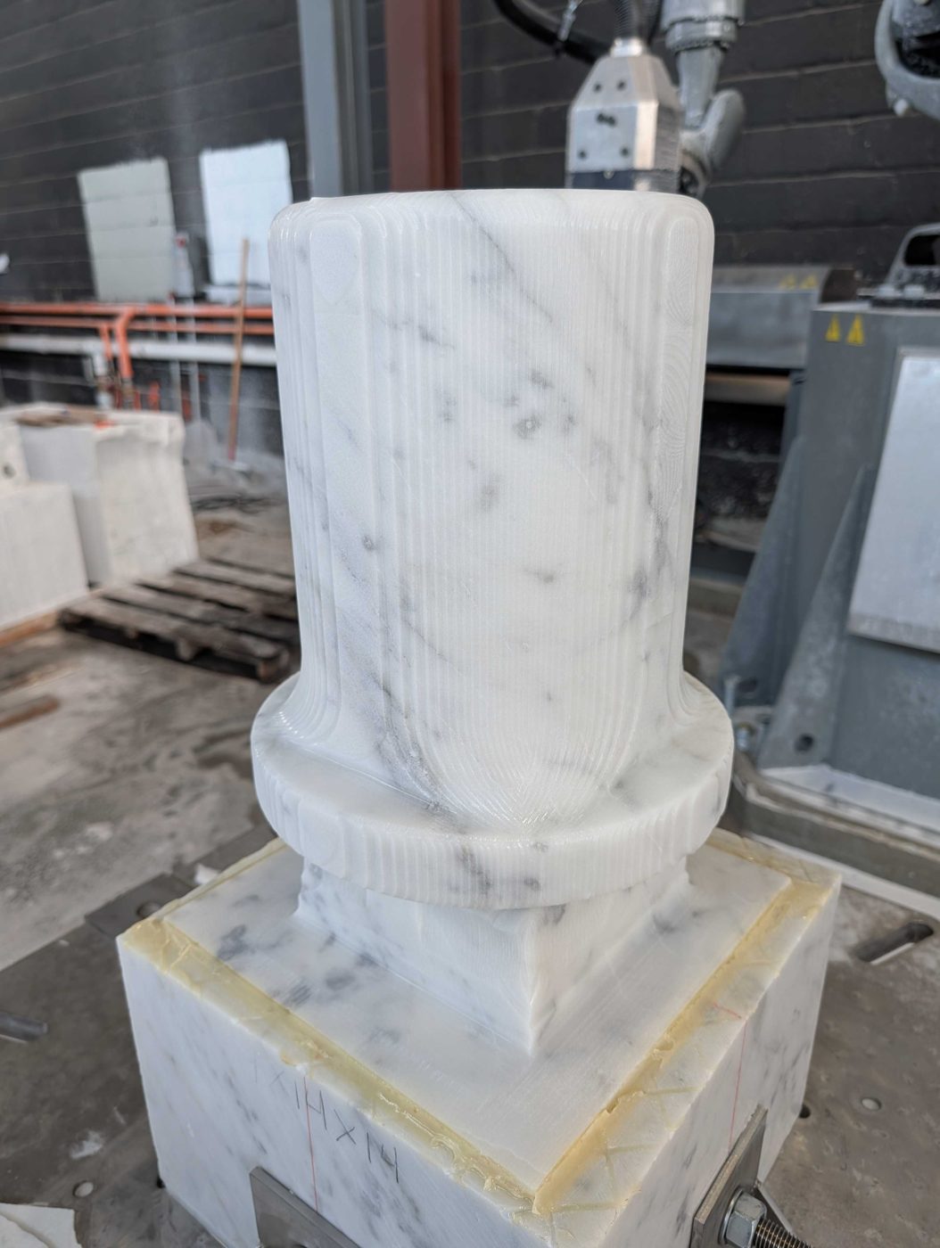 Marble block roughed into a top hat.