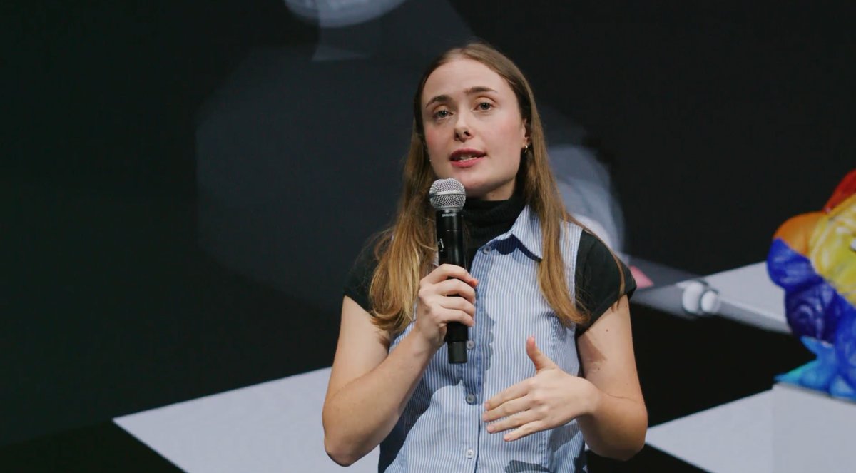 Eleanor Wiesler speaking on stage at Embodied AI NYC.